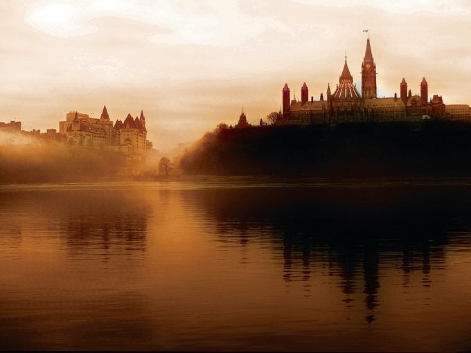 Rideau Canal history - Ottawa River and Parliament in sepia tone