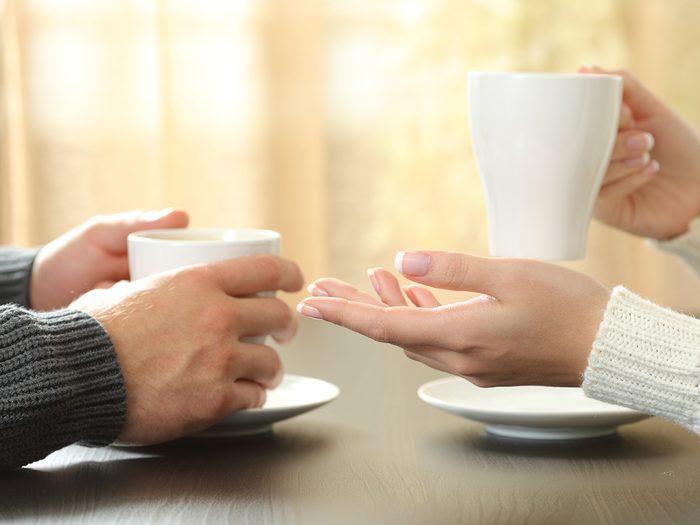 Disagreement over coffee - man and woman hands