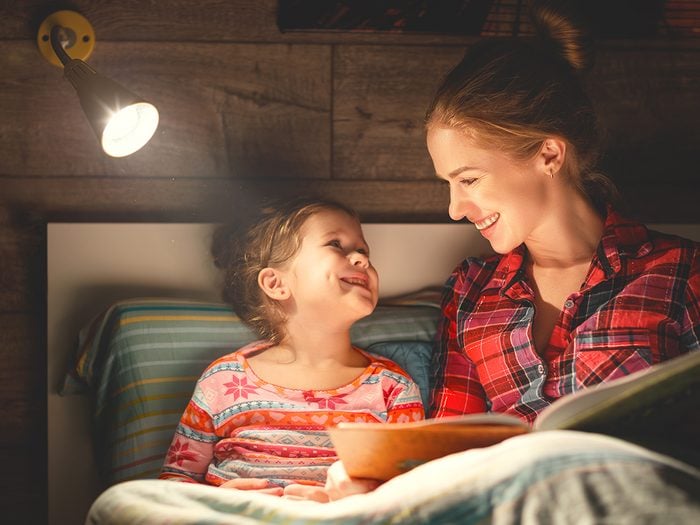 How to get deeper sleep - mom reading bedtime story to daughter