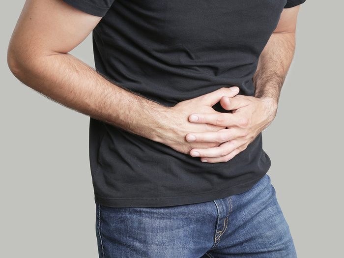 How to prevent food poisoning - man with stomach ache
