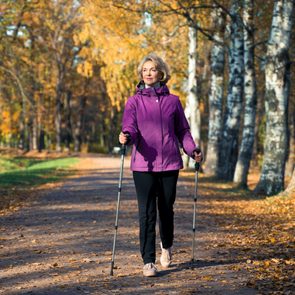 Benefits of Nordic Walking woman on trail
