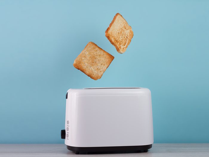 Bread popping out of toaster