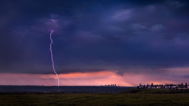 Lightning strike near Calgary skyline