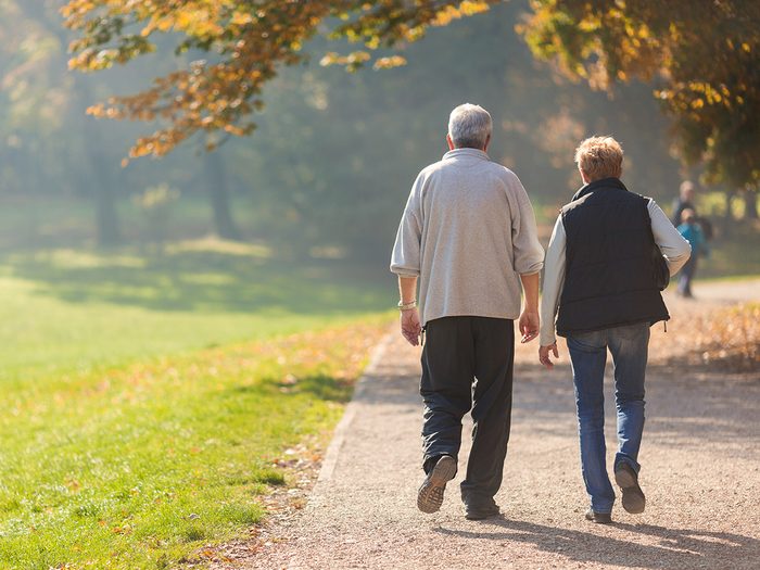 How to prevent diabetes - mature couple walking along trail