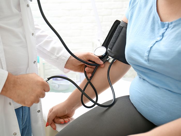 Risk factors for diabetes - woman having blood pressure test