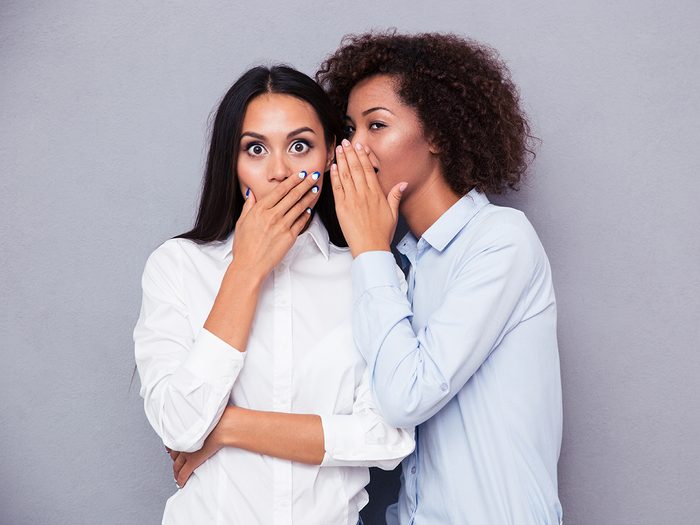 How to stop gossiping - two women sharing secret