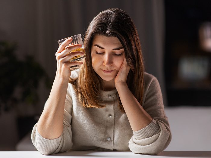 Woman drinking alone