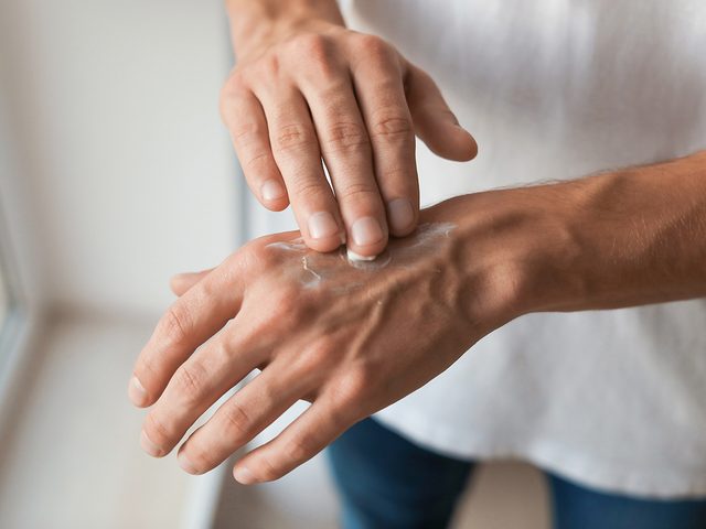 Best moisturizer for your skin - man applying hand cream