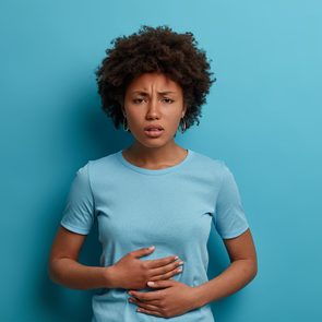 Can stress cause an ulcer - woman with stomach pain