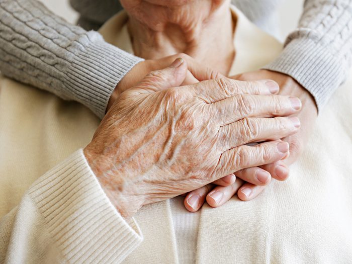 Caring for aging parents - hugging elderly woman