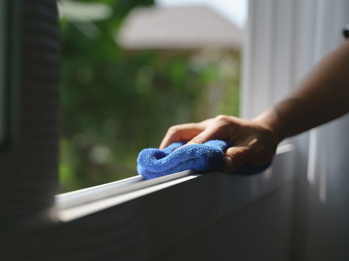 Spring cleaning checklist - wiping down window frame