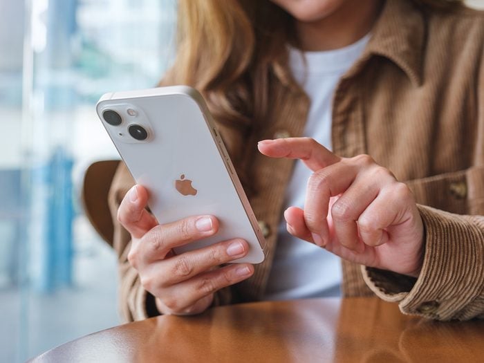 Woman texting on iPhone