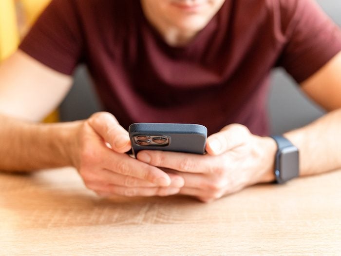 Man scrolling on phone