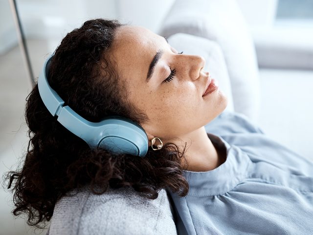 Mental health apps - woman sleeping with headphones