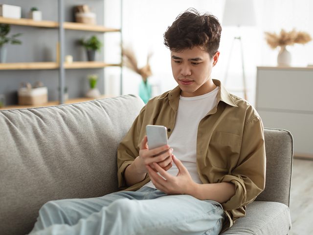 Mental health apps - young man using phone