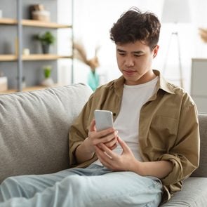 Mental health apps - young man using phone