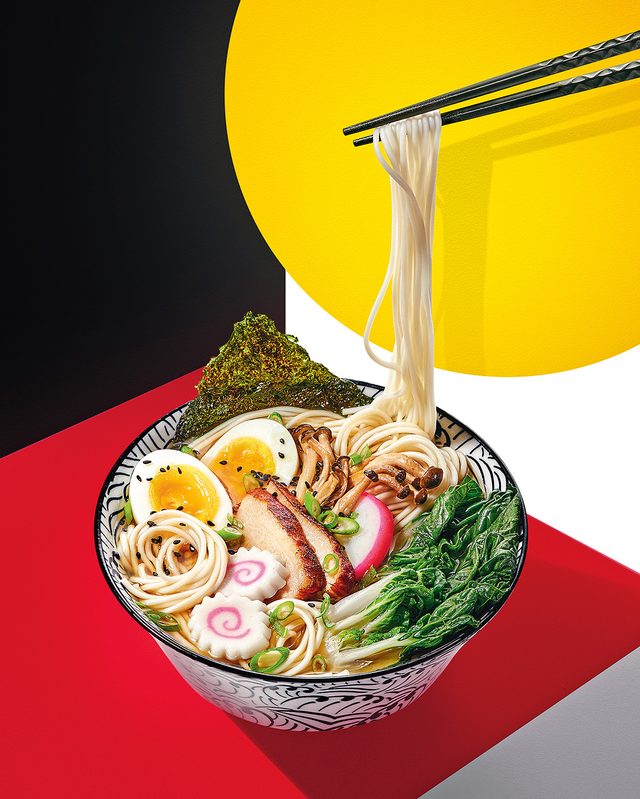 Origin Of Ramen - chopsticks and bowl of ramen with toppings