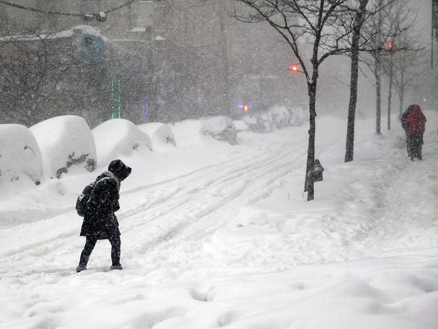 Weather Facts - People walking through heavy snow