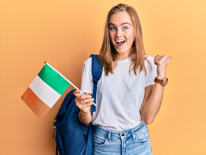 Woman holding Irish flag 