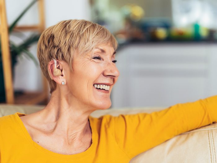Mature woman wearing subtle hearing aid