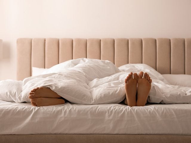 Sleeping Tips - Couple feet under covers