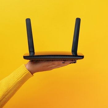 Woman holding Wi-Fi router