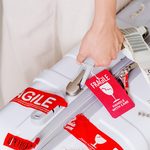 Why You Should Always Remove Those Small Baggage Stickers After Flying