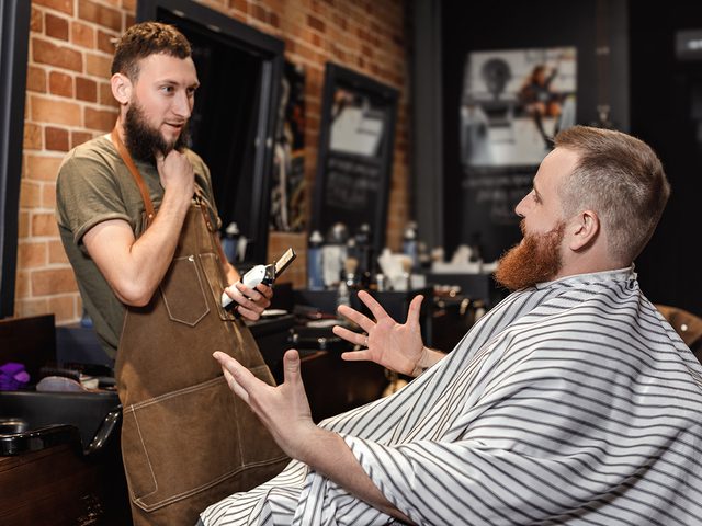 Man chatting with barber