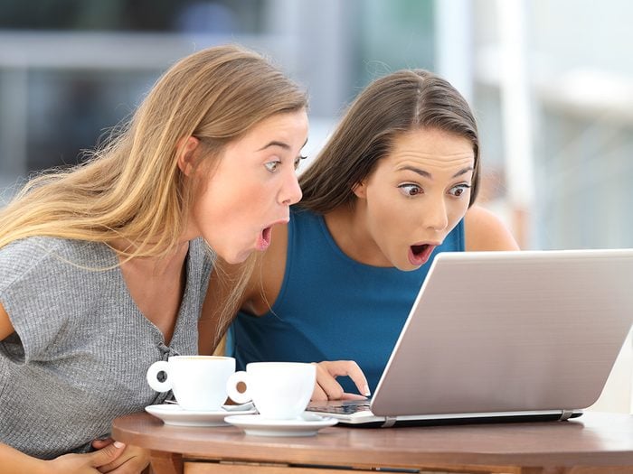 Yiddish Words - Shanda - Two women with gaping mouths looking at laptop screen