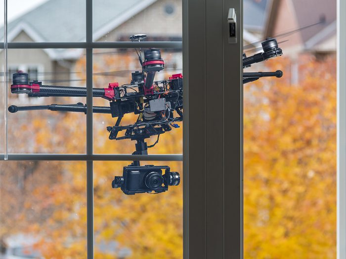 Canada Drone Laws - Drone flying behind open window