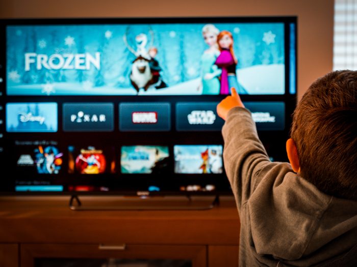 Disney Facts - Boy pointing to TV with Frozen movie on screen
